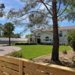 Front yard with wooden fence